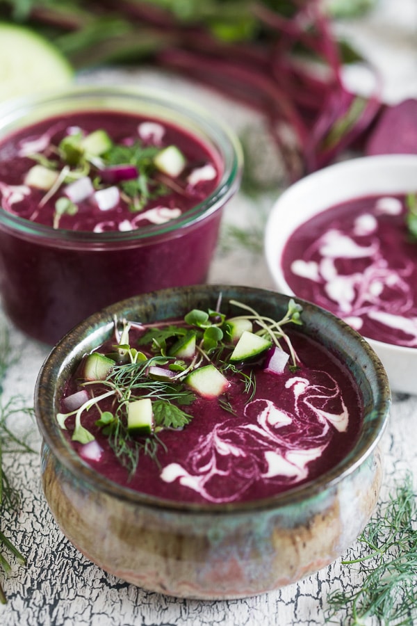 This summery beet gazpacho is packed full of vegetables and topped with fresh herbs, fresh chopped vegetables and a drizzle of Greek yogurt. You'll love how simple this soup is to throw together and it's perfect for hot summer nights.