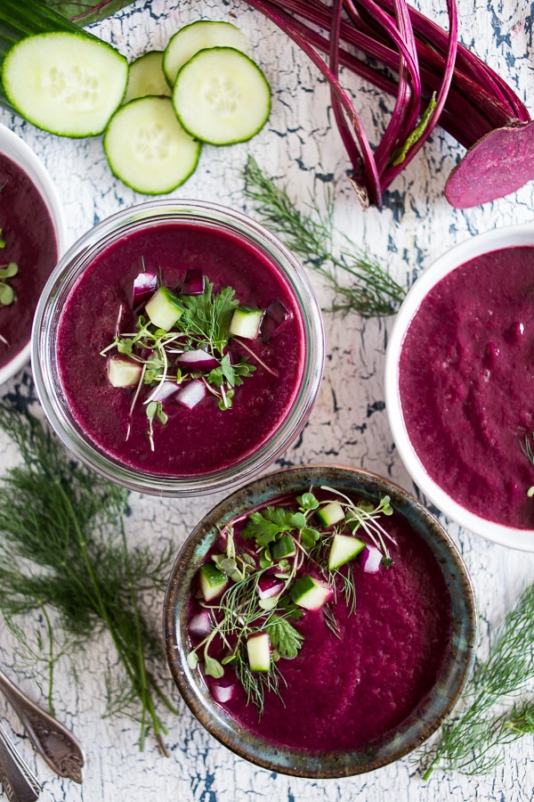 This summery beet gazpacho is packed full of vegetables and topped with fresh herbs, fresh chopped vegetables and a drizzle of Greek yogurt. You'll love how simple this soup is to throw together and it's perfect for hot summer nights.