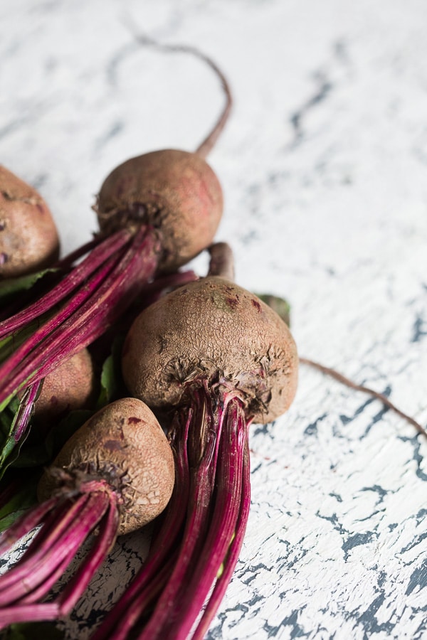 This summery beet gazpacho is packed full of vegetables and topped with fresh herbs, fresh chopped vegetables and a drizzle of Greek yogurt. You'll love how simple this soup is to throw together and it's perfect for hot summer nights.
