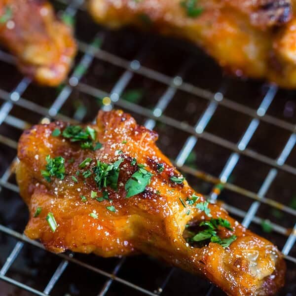 These sweet and spicy honey sriracha chicken wings are the perfect game day appetizer or weeknight dinner. Baked in the oven so they come out super crispy and glazed to perfection.