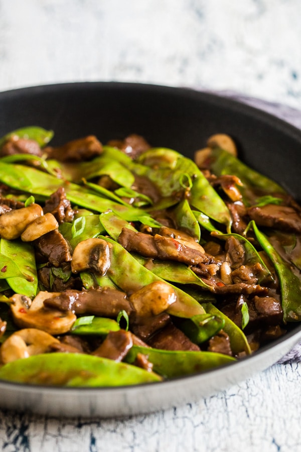 Beef Snow Pea Skillet served on a serving board.