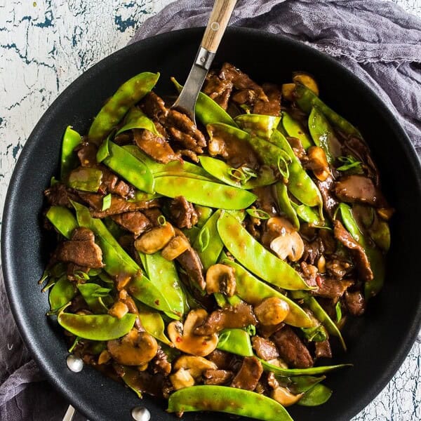 This 20 minute beef snow pea skillet is the perfect fast weeknight meal with a little takeout fake-out feel. Made all in one skillet and easily served alone or on top of rice. You'll love how easy and delicious this meal is to make!