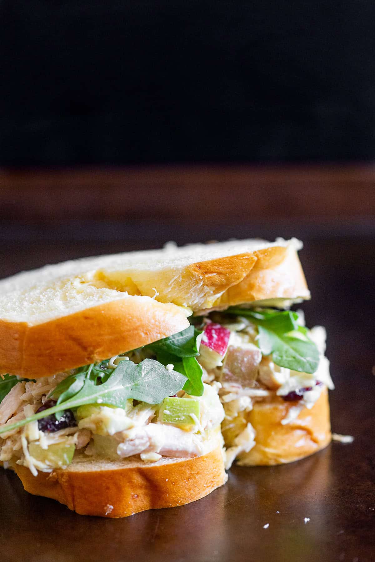 Hummus Chicken Salad on bread with arugula.