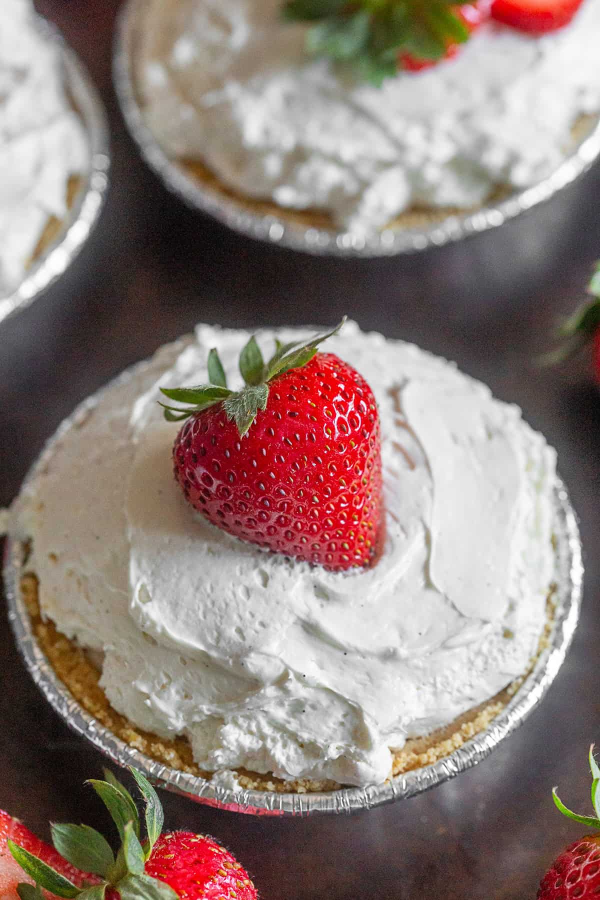 No Bake Strawberry Tarts with a full berry on top. 