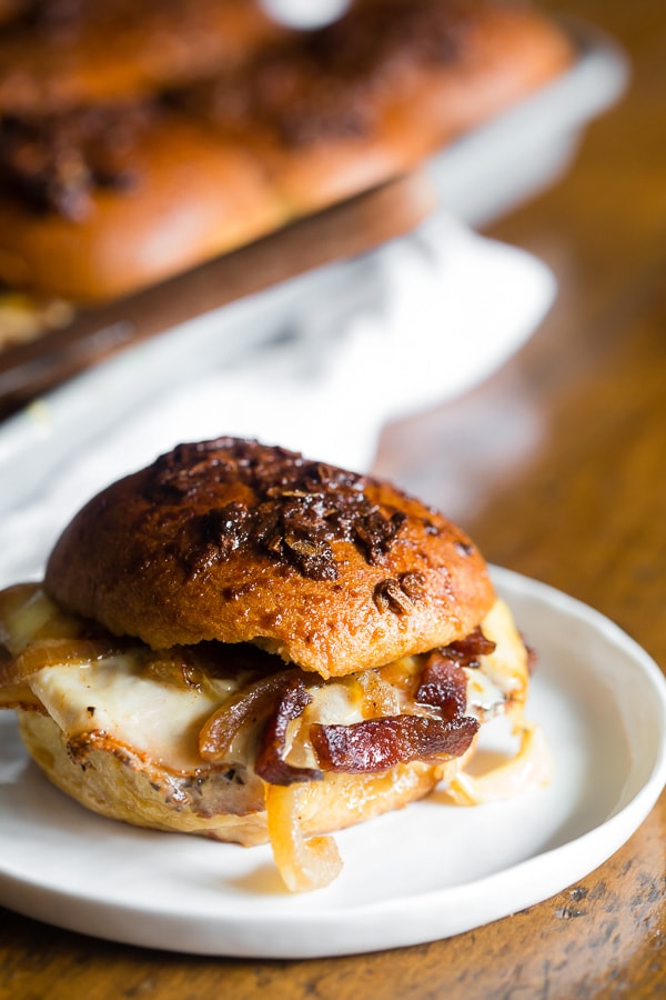 Baked Turkey Bacon Onion Sandwiches on a white plate.