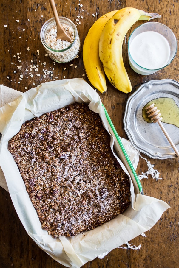 Banana Bread Crisp on a table with plates and honey.