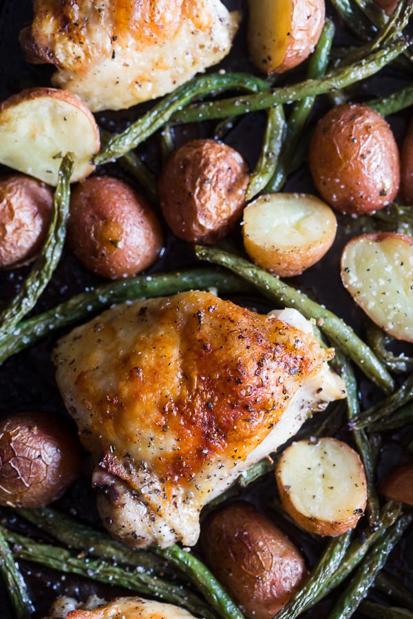 This sheet pan chicken and potato dinner with green beans is ready in under an hour and devoured in just minutes. You'll love how easy this dinner is to throw together and it will be sure to impress even the pickiest of eaters!