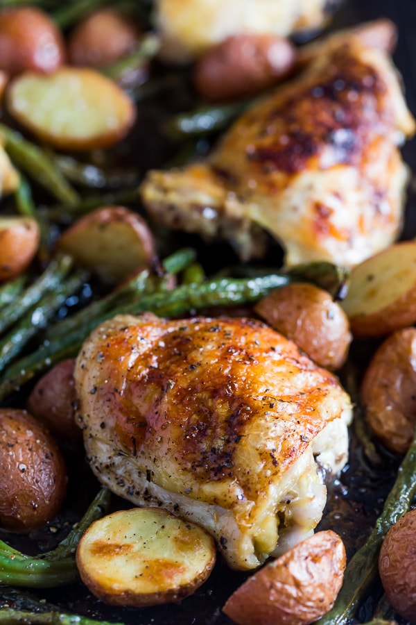 This sheet pan chicken and potato dinner with green beans is ready in under an hour and devoured in just minutes. You'll love how easy this dinner is to throw together and it will be sure to impress even the pickiest of eaters!