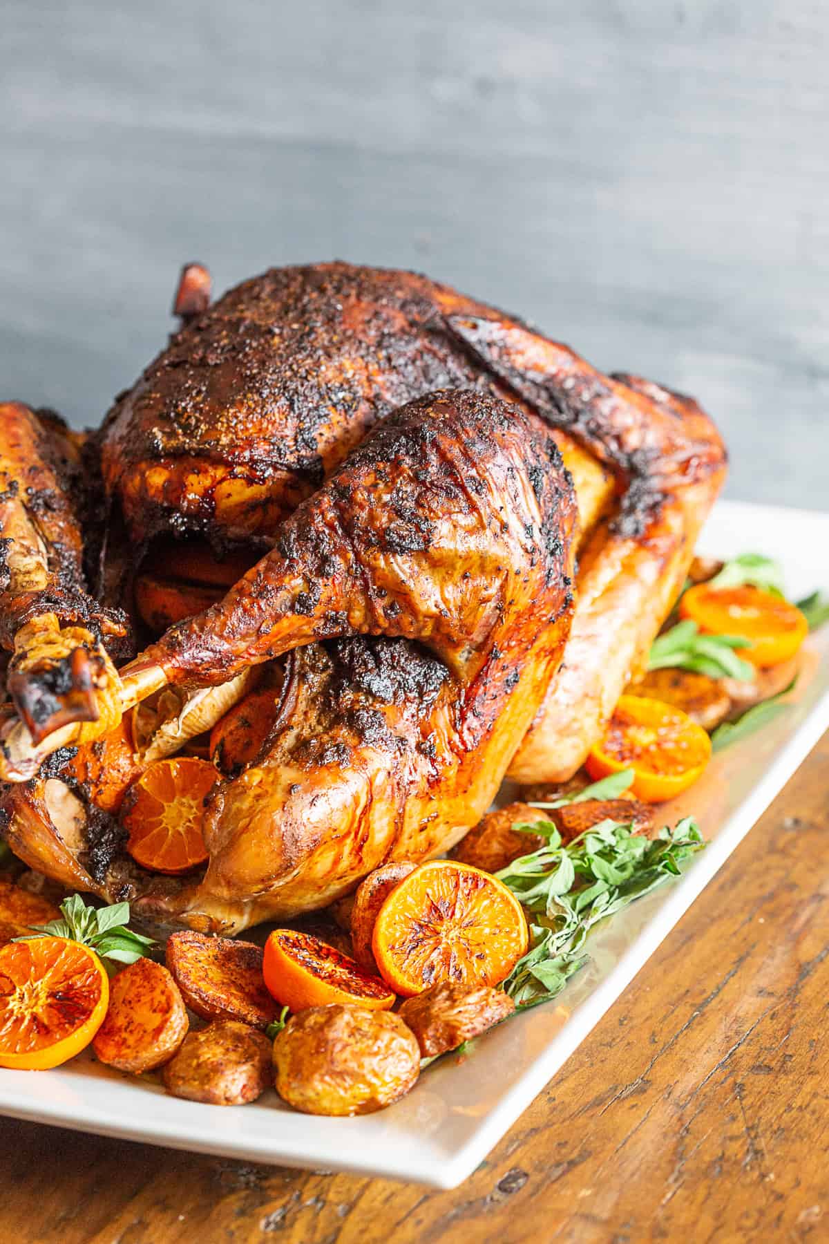 A cooked Adobo Butter Turkey served on a white platter. 