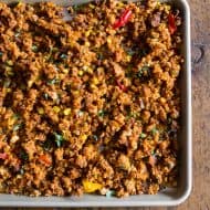 This chorizo sheet pan stuffing is packed full of cornbread, chorizo, peppers, onions and garlic. It's the perfect spicy twist to your normal every day Thanksgiving stuffing. Make your day even easier by prepping the day before and heating up before you feast!