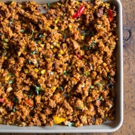 This chorizo sheet pan stuffing is packed full of cornbread, chorizo, peppers, onions and garlic. It's the perfect spicy twist to your normal every day Thanksgiving stuffing. Make your day even easier by prepping the day before and heating up before you feast!
