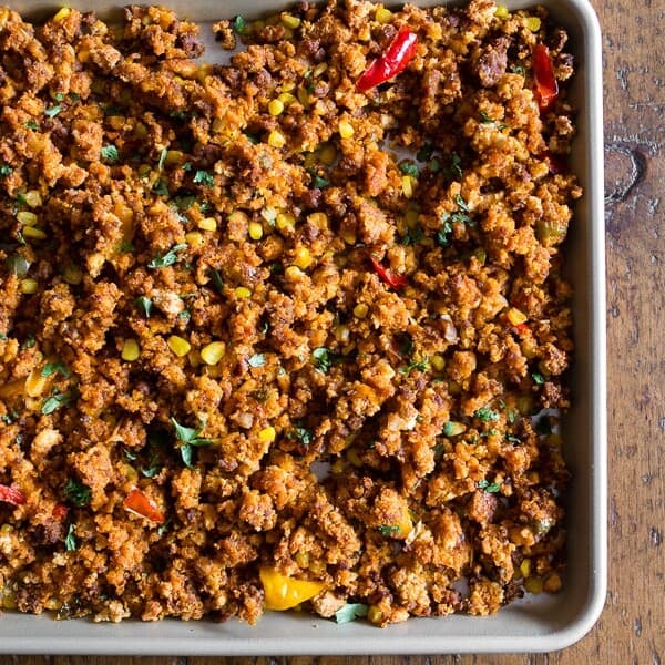 This chorizo sheet pan stuffing is packed full of cornbread, chorizo, peppers, onions and garlic. It's the perfect spicy twist to your normal every day Thanksgiving stuffing. Make your day even easier by prepping the day before and heating up before you feast!