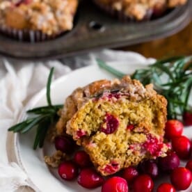 These cranberry orange rosemary muffins are packed full of fresh cranberries, topped with oatmeal streusel and drizzled with an orange glaze. These muffins are the perfect way to start your day and you'll love every single muffin bite.