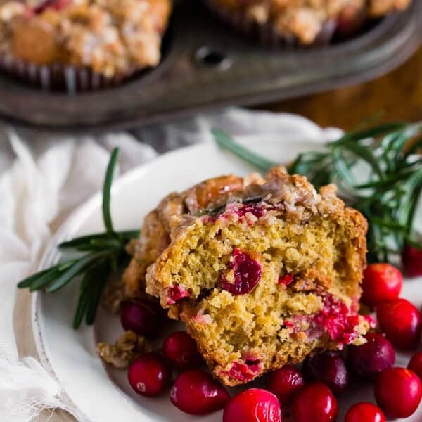 These cranberry orange rosemary muffins are packed full of fresh cranberries, topped with oatmeal streusel and drizzled with an orange glaze. These muffins are the perfect way to start your day and you'll love every single muffin bite.