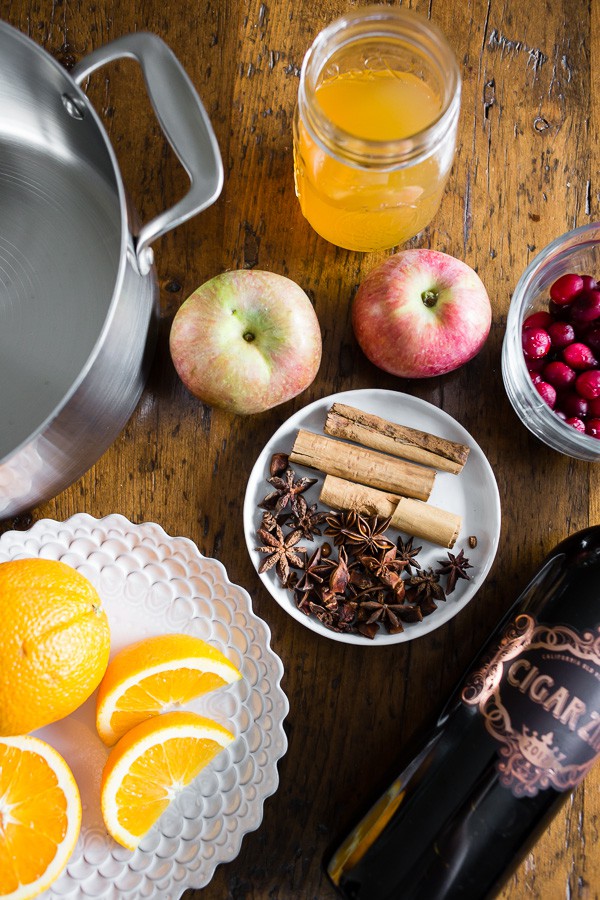 Holiday Spiced Mulled Wine ingredients on a table. 