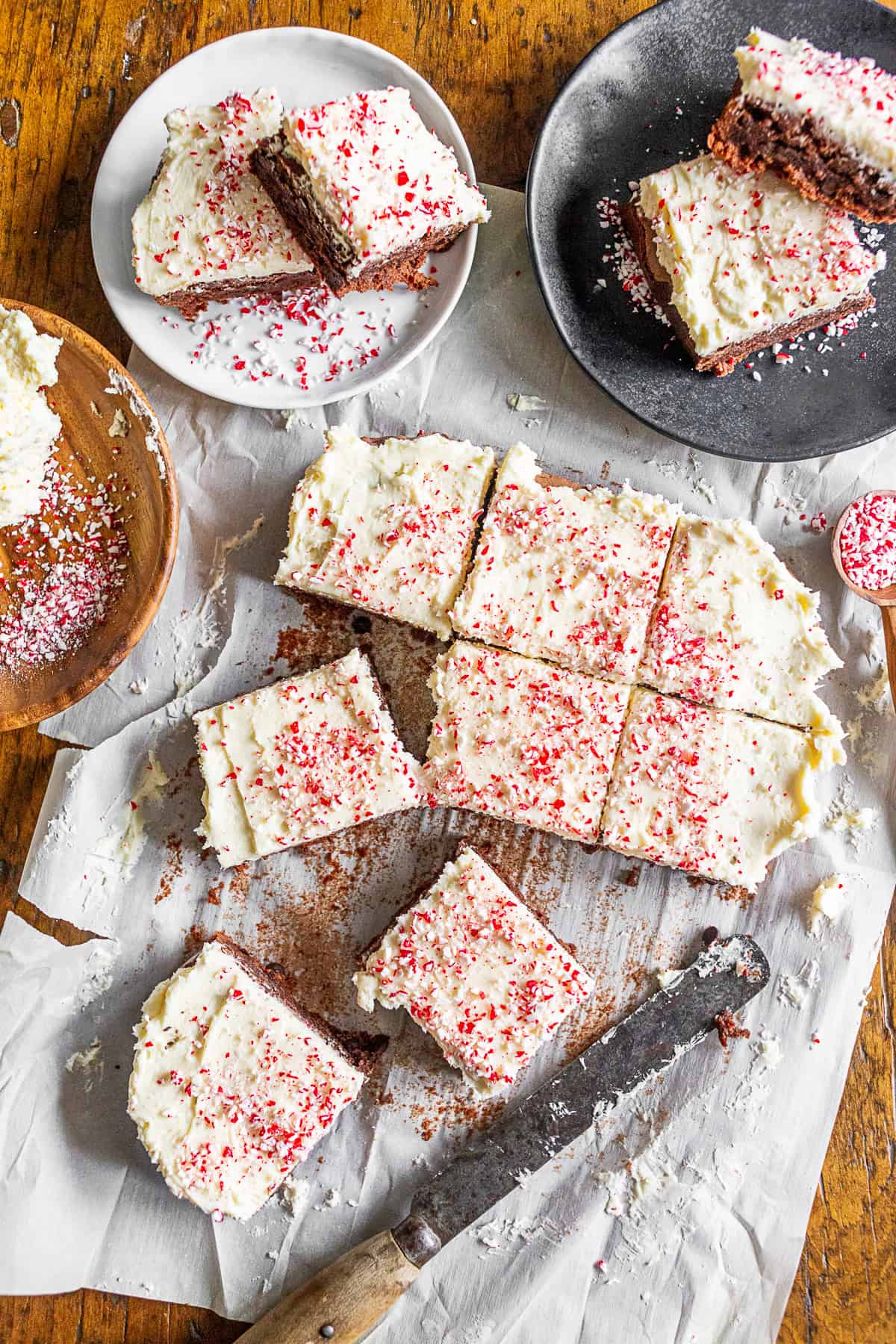 Easy Peppermint Brownies sliced and sitting on serving plates. 