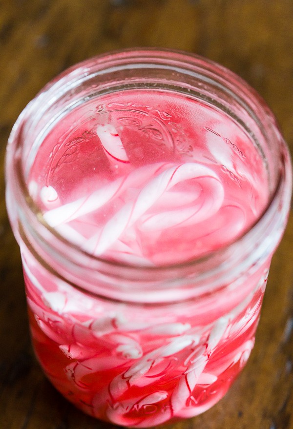 Homemade Candy Cane Vodka in a glass jar. 