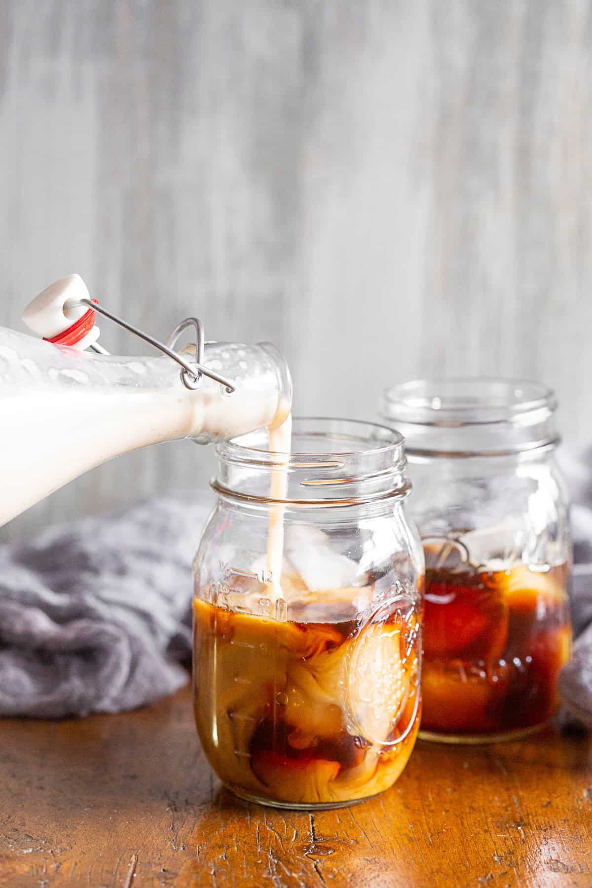 Pouring horchata into coffee. 
