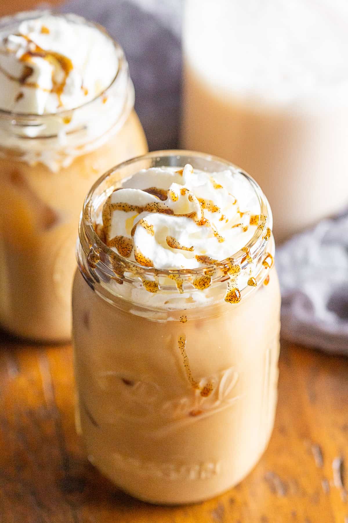 Iced Horchata Coffee in a glass with whipped cream. 