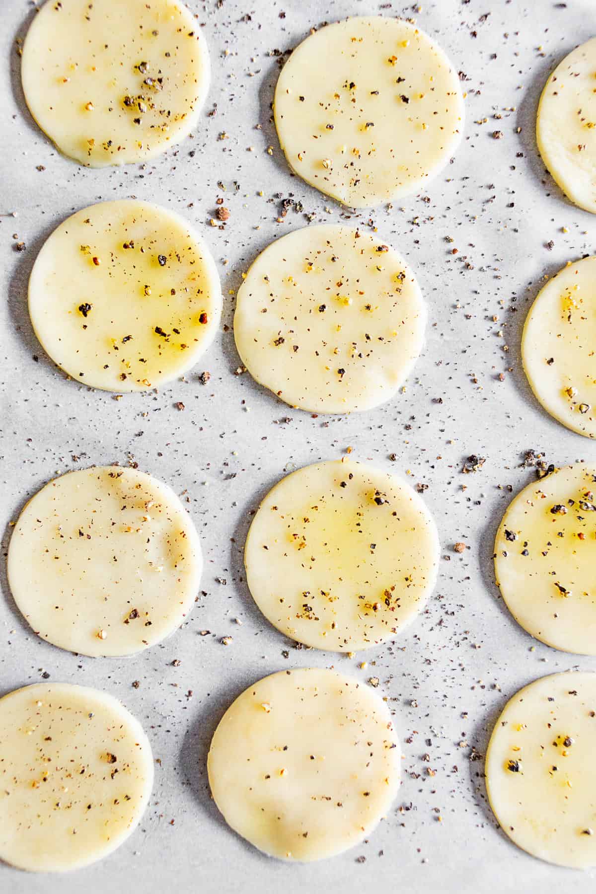 Uncooked pie crust round on a baking sheet pan. 