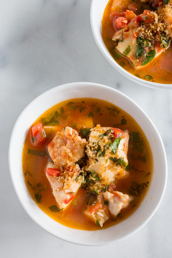 This 20 minute seafood stew has a light broth made from tomatoes, garlic, fresh herbs and white wine. Plus it's packed full of fresh cod and shrimp.