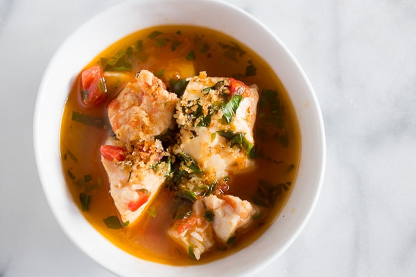 This 20 minute seafood stew has a light broth made from tomatoes, garlic, fresh herbs and white wine. Plus it's packed full of fresh cod and shrimp.