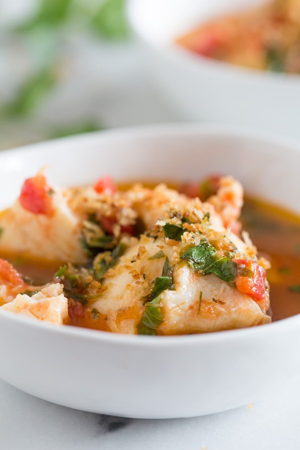 This 20 minute seafood stew has a light broth made from tomatoes, garlic, fresh herbs and white wine. Plus it's packed full of fresh cod and shrimp.