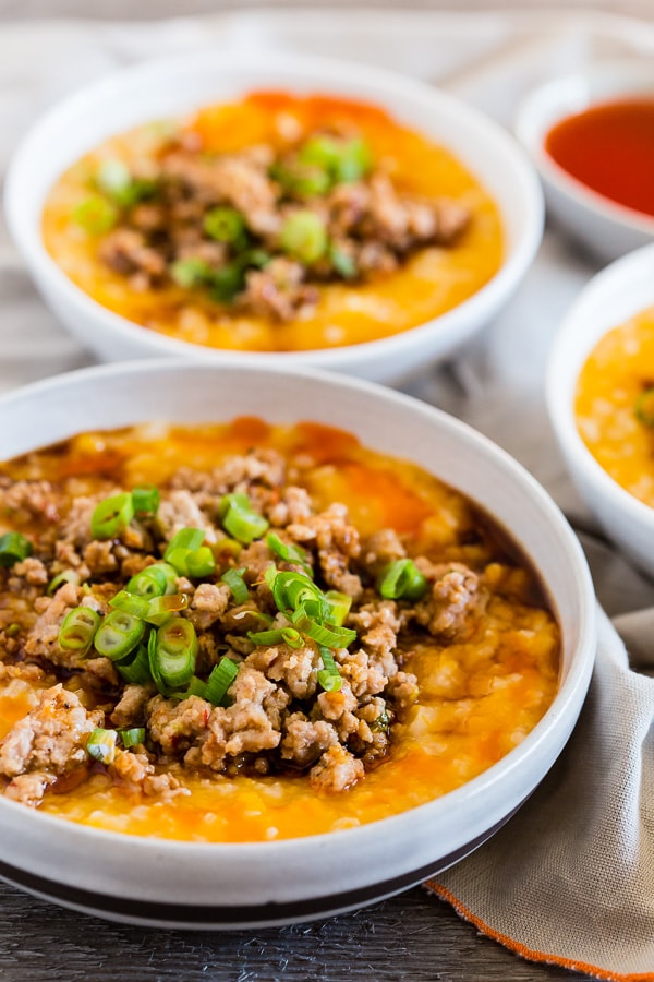 This pressure cooker butternut squash congee is topped with ground pork flavored with ginger, lemongrass, garlic, soy sauce and hot chili oil. This dish is 100% comfort food and can be enjoyed for breakfast, lunch or dinner. You'll love that it's ready in just 30 minutes by using your pressure cooker or Instant Pot.