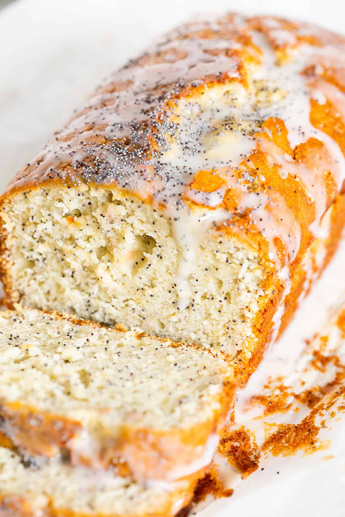 Grapefruit Poppy Seed Cake sliced to show poppy seed inside. 