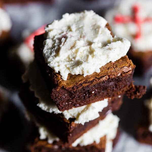 These espresso chocolate chip brownies are super fudgy and topped with a homemade fluffy vanilla bean buttercream. These are the type of brownies that will have you sneaking into the kitchen at midnight for a snack. Plus they are super simple to make!