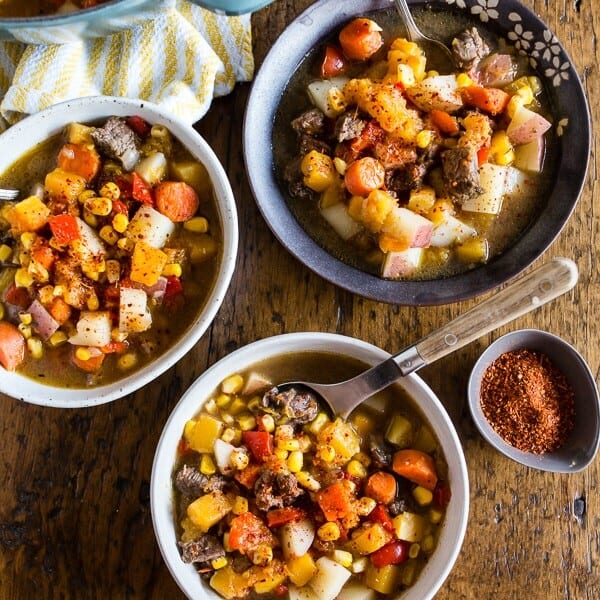 This Chilean carbonada soup is a classic dish found in Chile. It's pure comfort in the form of beef, corn, potatoes, pumpkin and carrots. It's easy to make and feels like comfort in a bowl. Plus, it's perfect for cool spring nights.