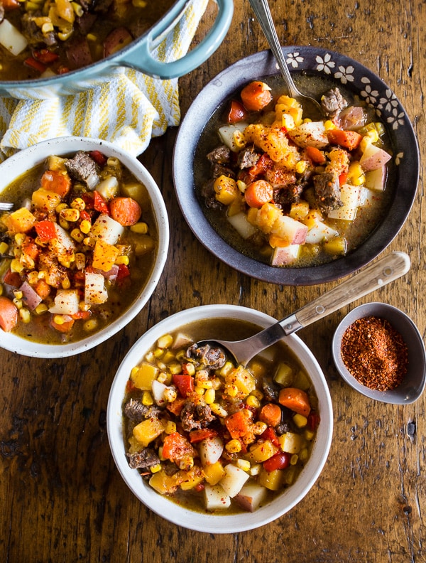 Chilean Carbonada Soup spooned into bowls. 