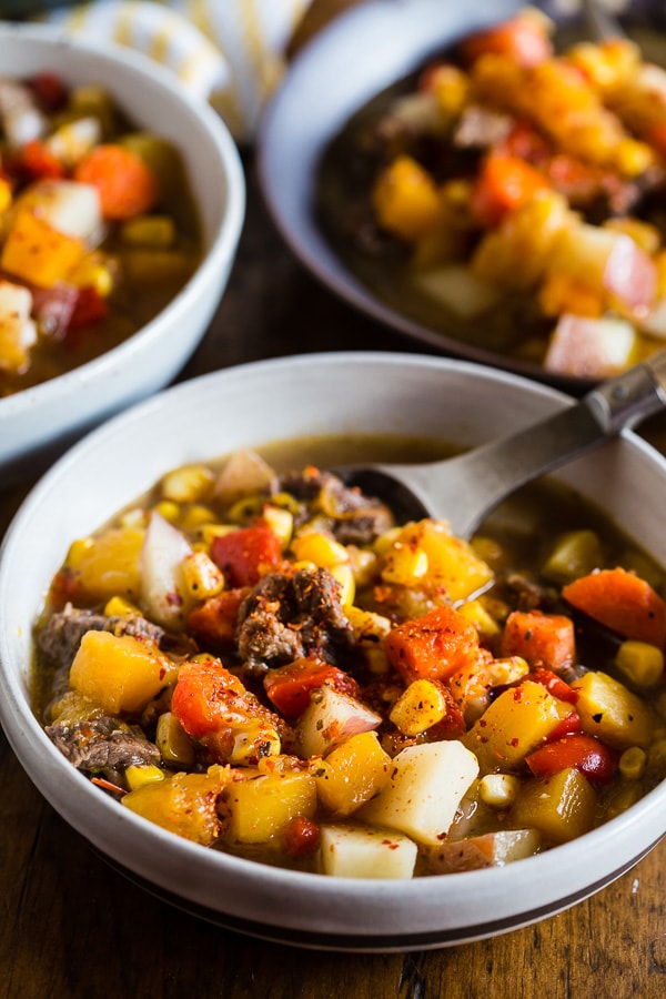 Chilean Carbonada Soup topped with merken. 