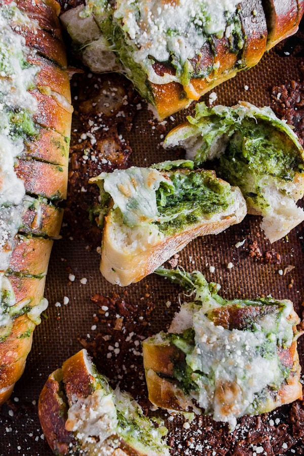 Cheesy Pesto Garlic Bread on a sheet pan. 