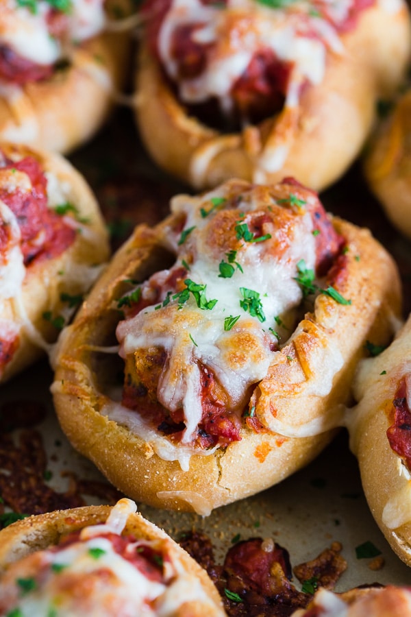 Mini Chicken Parmesan Meatball Subs on a sheet pan. 
