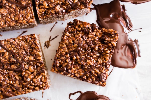 These peanut butter Nutella Rice Krispie treats are extra large, extra marshmallowy and crazy delicious! You're going to love how easy these treats are to make and they are ready in just 20 minutes! Plus to top them off I drizzled them with dark chocolate.