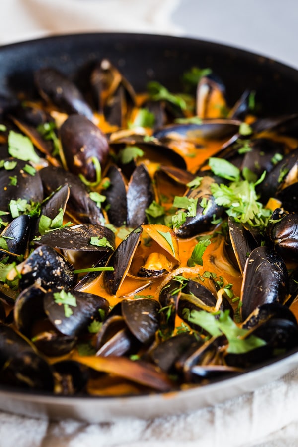 Coconut Curry Mussels in a pan.