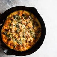 This sausage broccoli rabe skillet pizza is perfectly seasoned and made with 3 different delicious kinds of cheese. It's made right in a 12-inch cast iron skillet and comes out perfectly crisp.