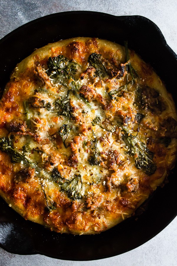 Sausage Broccoli Rabe Skillet Pizza in a skillet.
