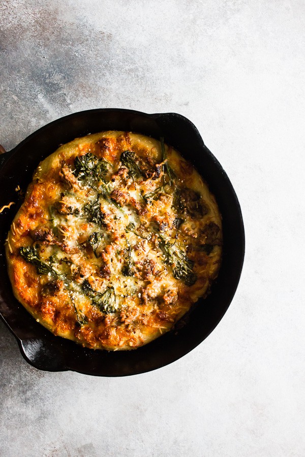 Sausage Broccoli Rabe Skillet Pizza in a cast iron skillet.