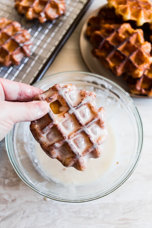 These apple butter waffle donuts are the perfect sweet Easter brunch treat. Perfectly spiced apple butter waffles fried to donut perfection and dipped in a vanilla bean glaze. You'll love these sweet little donut treats.