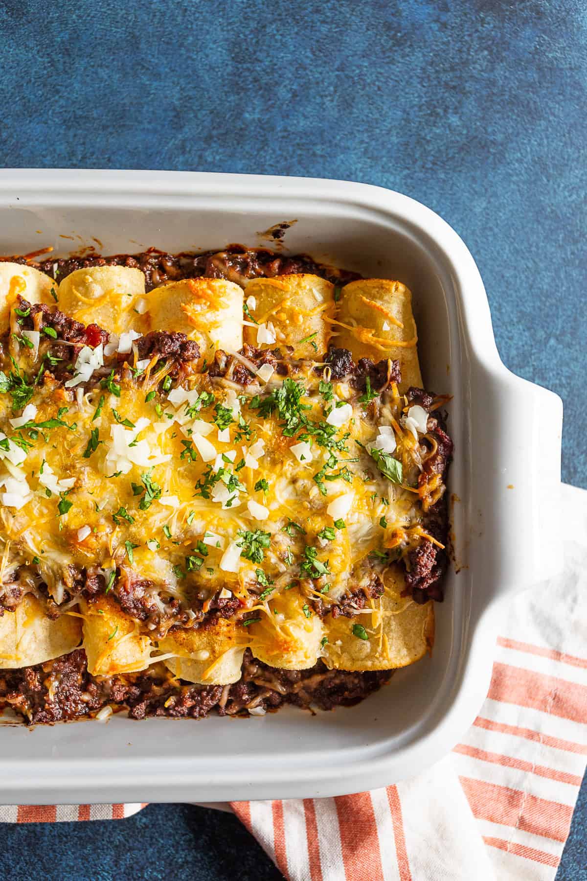 Chipotle Ground Beef Enchiladas in a white dish. 