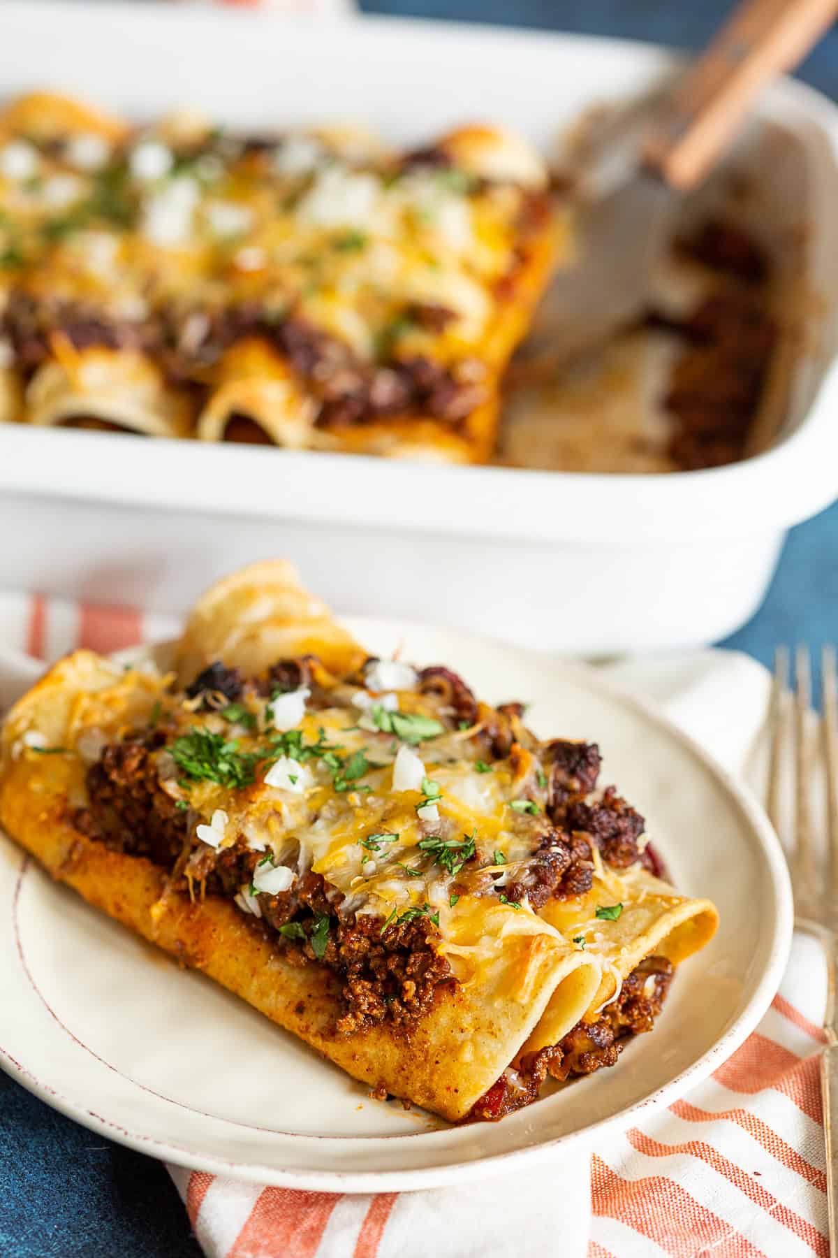 Chipotle Ground Beef Enchiladas on a small plate. 