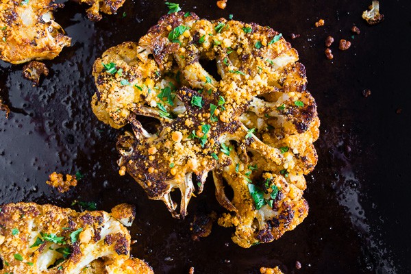 Parmesan Cajun Spiced Cauliflower Steak on a cooking pan. 