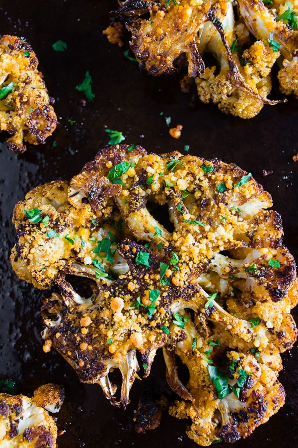 Parmesan Cajun Spiced Cauliflower Steak on a sheet pan. 