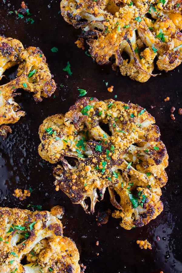 Parmesan Cajun Spiced Cauliflower Steak topped with parsley. 