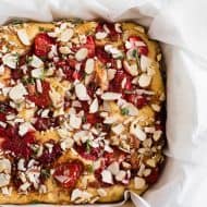 This roasted strawberry olive oil cake is perfect for spring! Super simple to make and perfect for dessert or even breakfast. You'll love how easy it is to make roasted strawberries and you'll love them even more when put into a cake!
