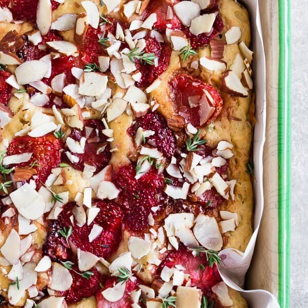This roasted strawberry olive oil cake is perfect for spring! Super simple to make and perfect for dessert or even breakfast. You'll love how easy it is to make roasted strawberries and you'll love them even more when put into a cake!
