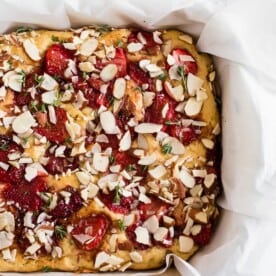 This roasted strawberry olive oil cake is perfect for spring! Super simple to make and perfect for dessert or even breakfast. You'll love how easy it is to make roasted strawberries and you'll love them even more when put into a cake!