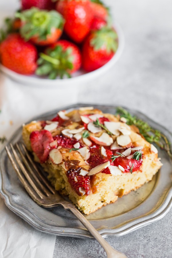 Olive Oil Cake topped with extra fresh thyme. 